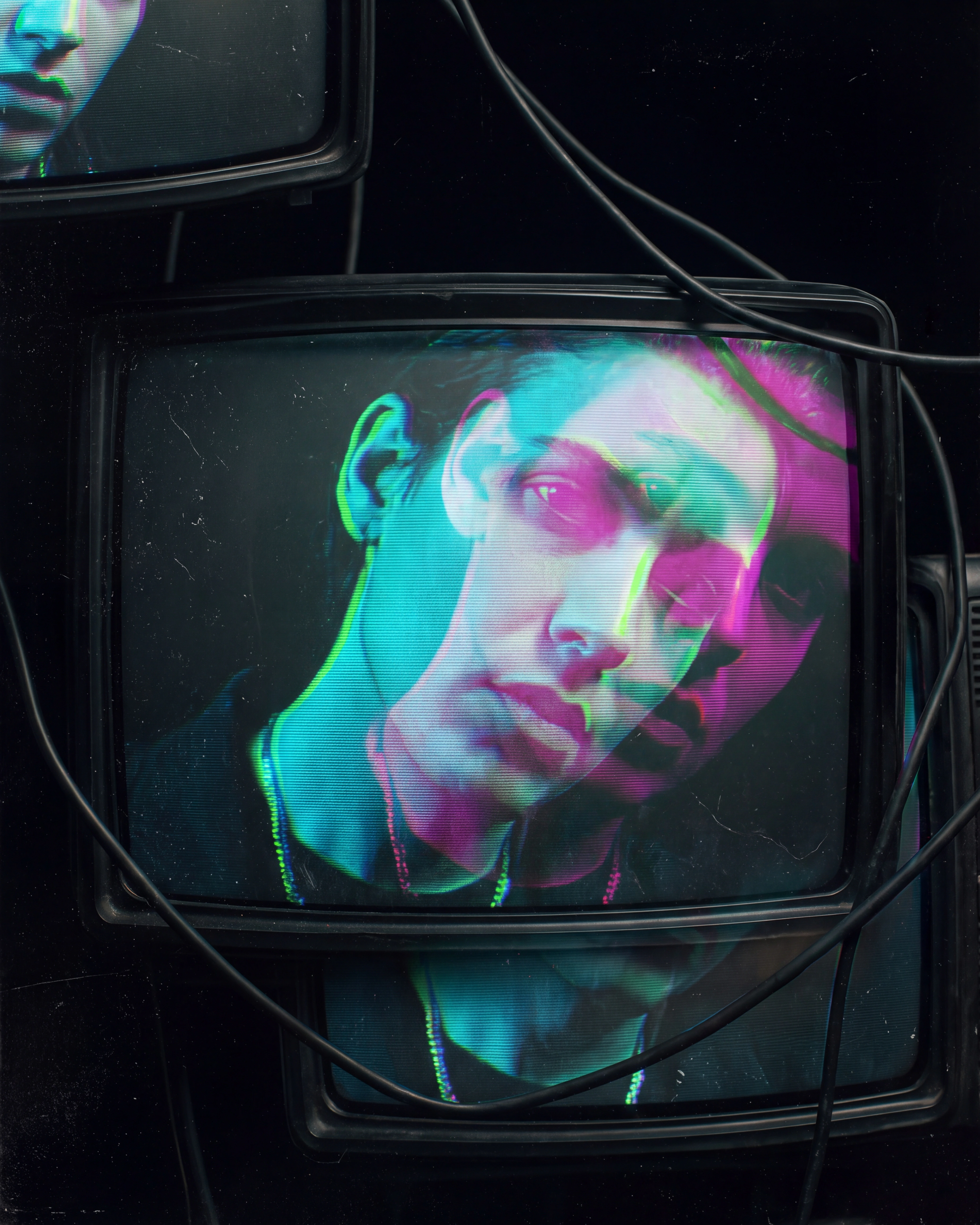 Vocalist seen through CRT glass in cyan, magenta, and electric-lime signal spill.