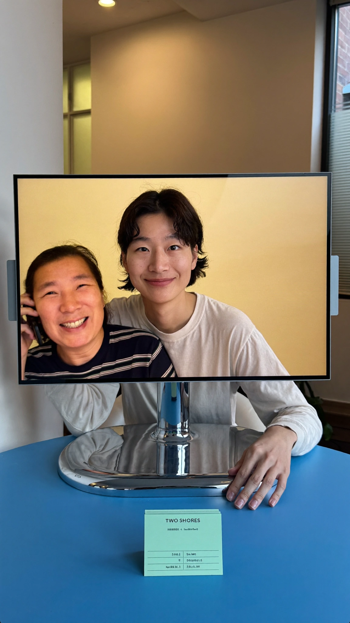 Migrant professional video-calling family across two distant time zones.